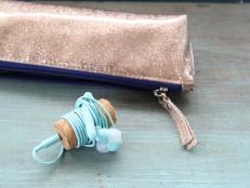 earbuds wrapped around wine cork