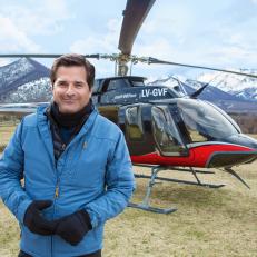 BAGUALES, PATAGONIA, ARGENTINA -SEPTEMBER 11 2017: Host Don Wildman  pauses next to his helicopter as he examins the October 1972 crash of the plane carrying an Uruguayan Rugby team in the Andes mountains during the filming of "Mysteries at the Museum Special: ALIVE". After a visit to the Andes Tragedy and Miracle Museum in Montevideo, Uruguay, Don Wildman learns firsthand what it took for the crash's sixteen survivors to overcome avalanches, sub-zero temperatures, and lack of food at 12.000 feet, and the devastating news that the search for them had been called off, as described in survivor Nando Parrado's book "Miracle in the Andes" (photo Gilles Mingasson for The Travel Channel).